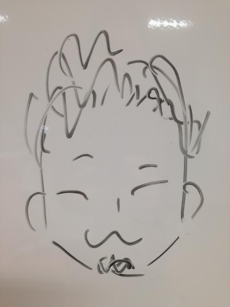 ゼミ学生が描いた似顔絵。シンプルな線画で、笑顔の男性の顔が表現されている。
