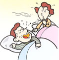 いびきをかいている男性がベッドで寝ており、驚いた表情の女性が隣で見ているイラスト。