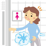 女性が急いでトイレに駆け込もうとしている様子。